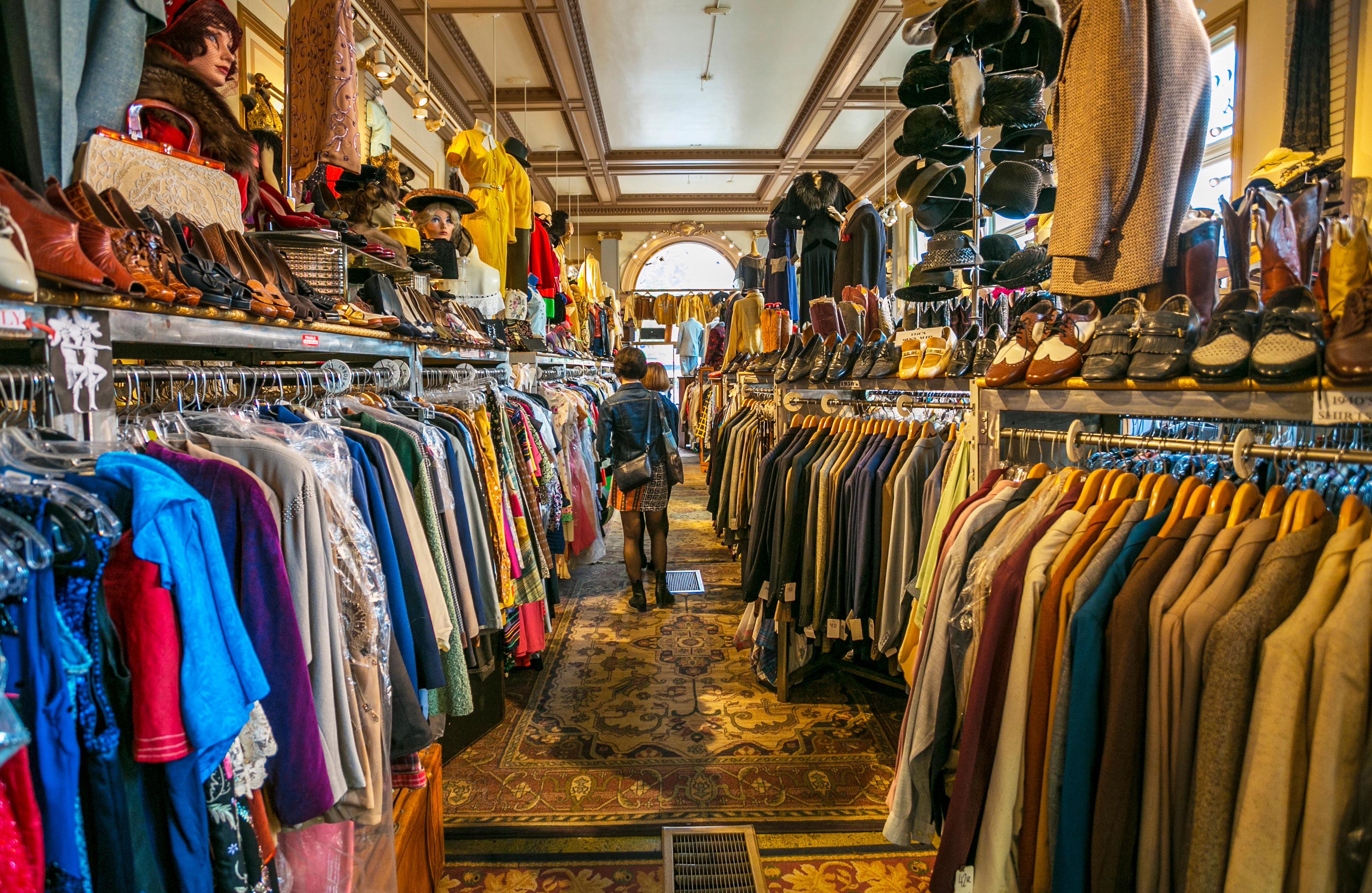 A shopper browses racks of vintage clothing in a Haight-Ashbury shop.