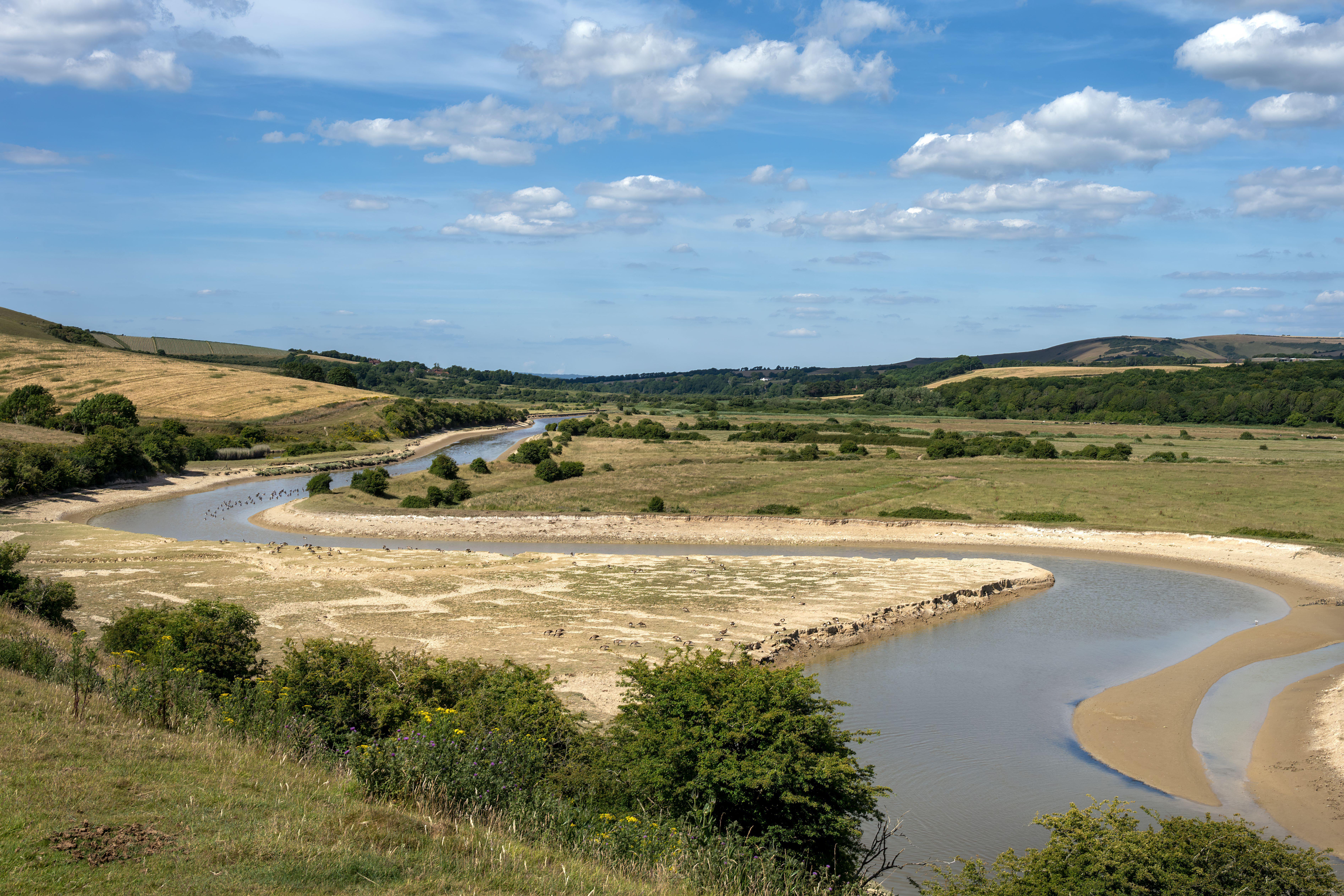 View of the Cuckmere River in the South Downs National Park, East Sussex, England.