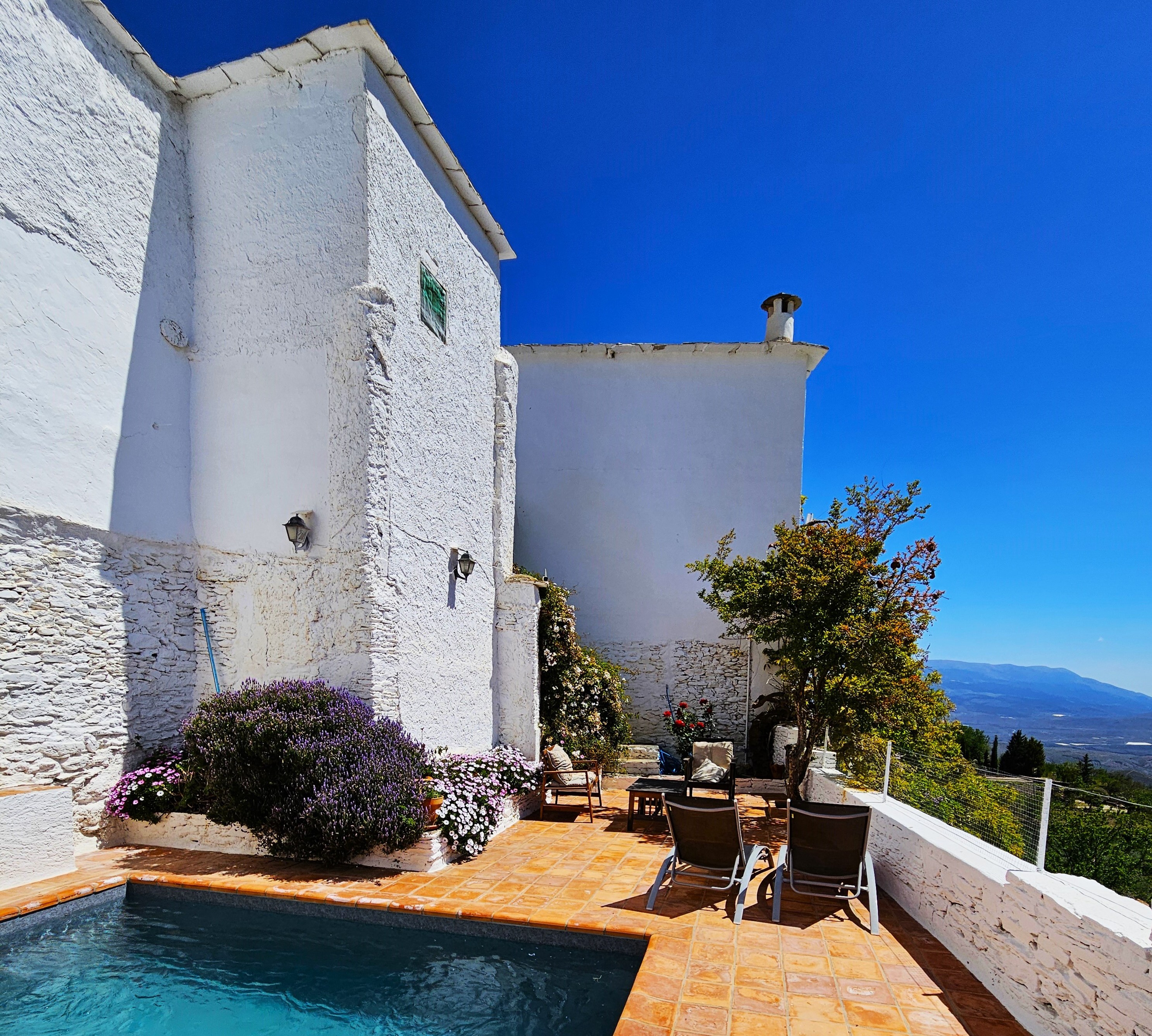 Swimming pool and patio area at a Spanish villa.