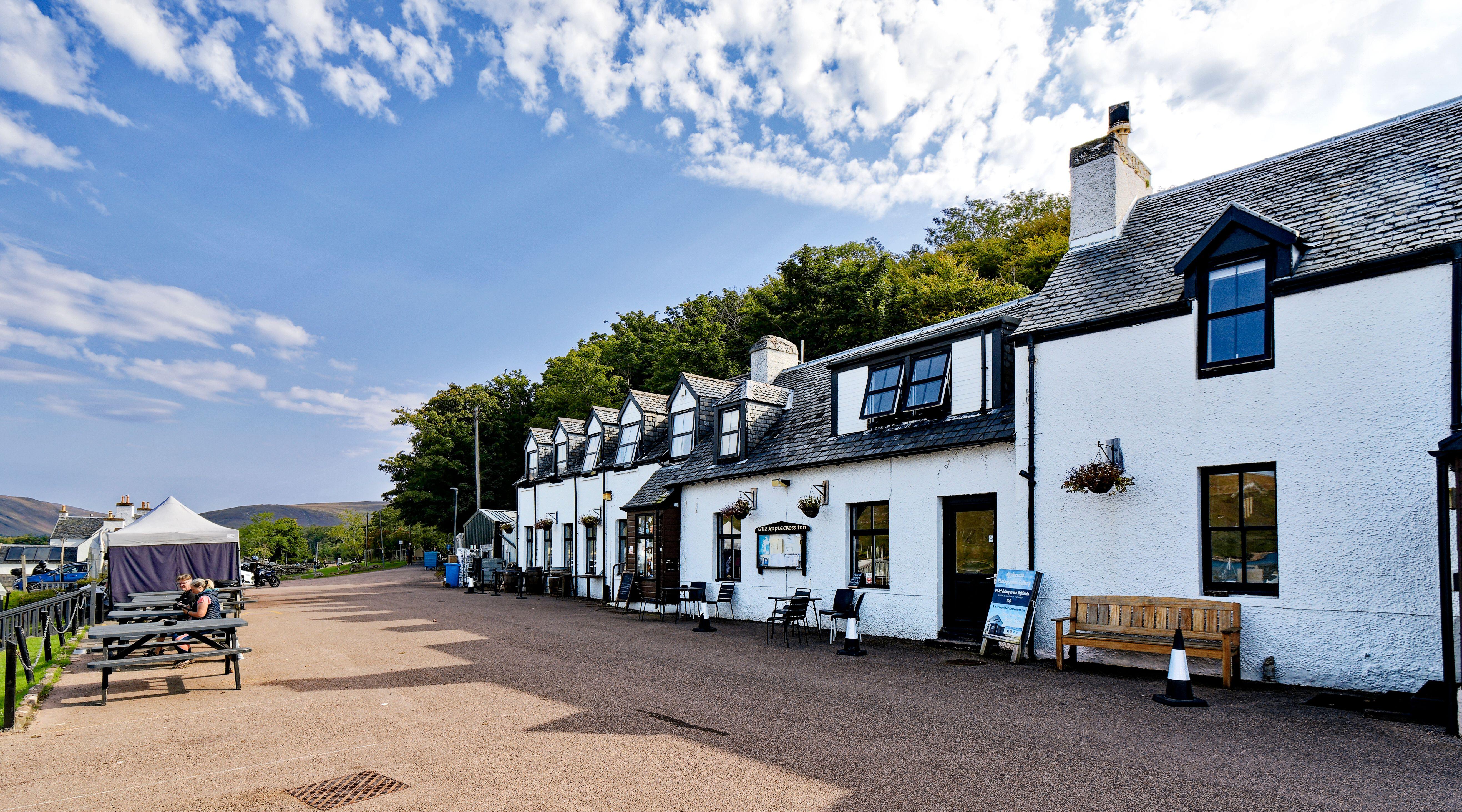 The Applecross Inn in Scotland overlooking a bay.